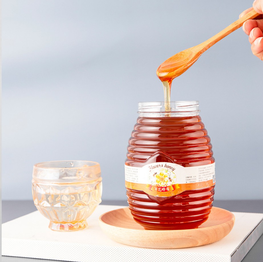 Frascos de miel de vidrio vacío de flint 100ml 250ml 500ml 1000ml Jam Jam Jares Botella en forma de ovalado al por mayor
